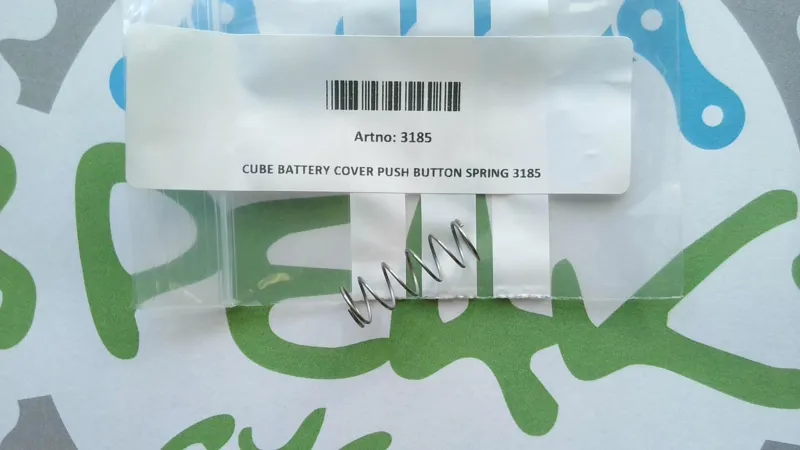 Cube Battery Cover Push Button Spring 3185